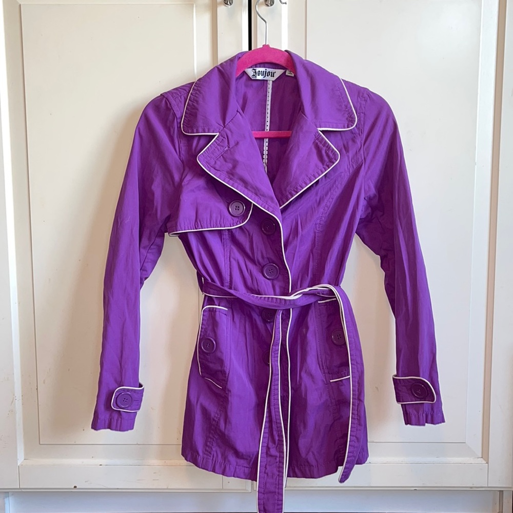 Purple raincoat with white stitching
